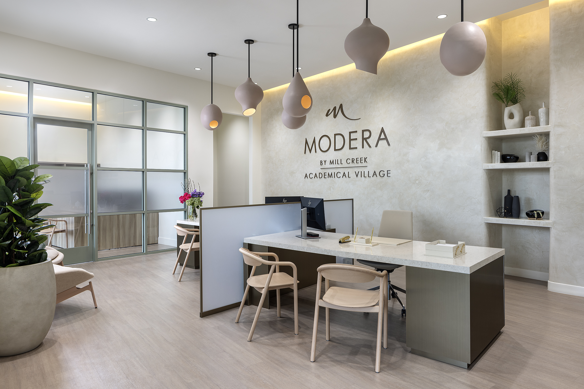 Reception area with custom desk and branding wall