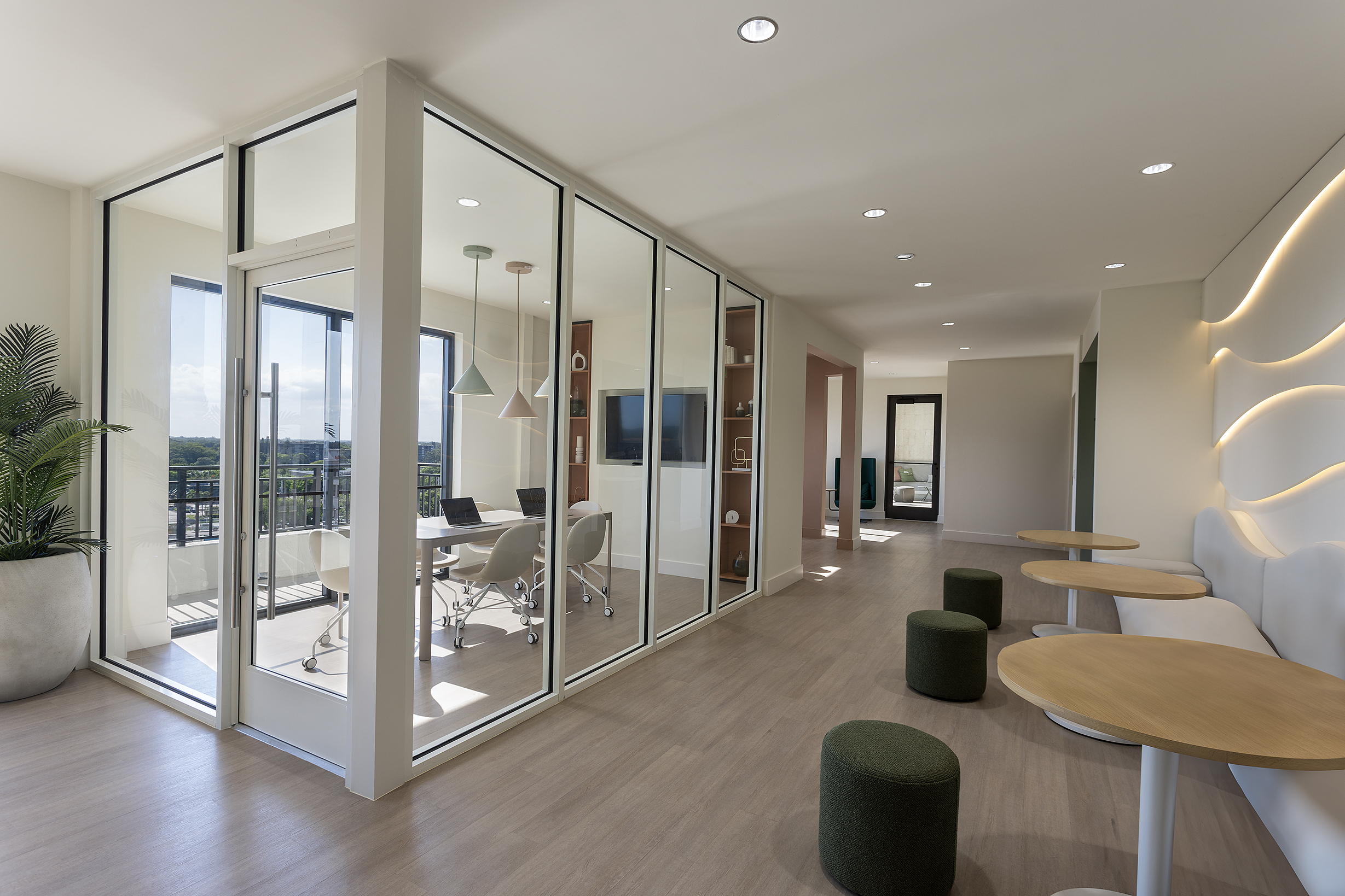 Meeting room with glass partitions and city views