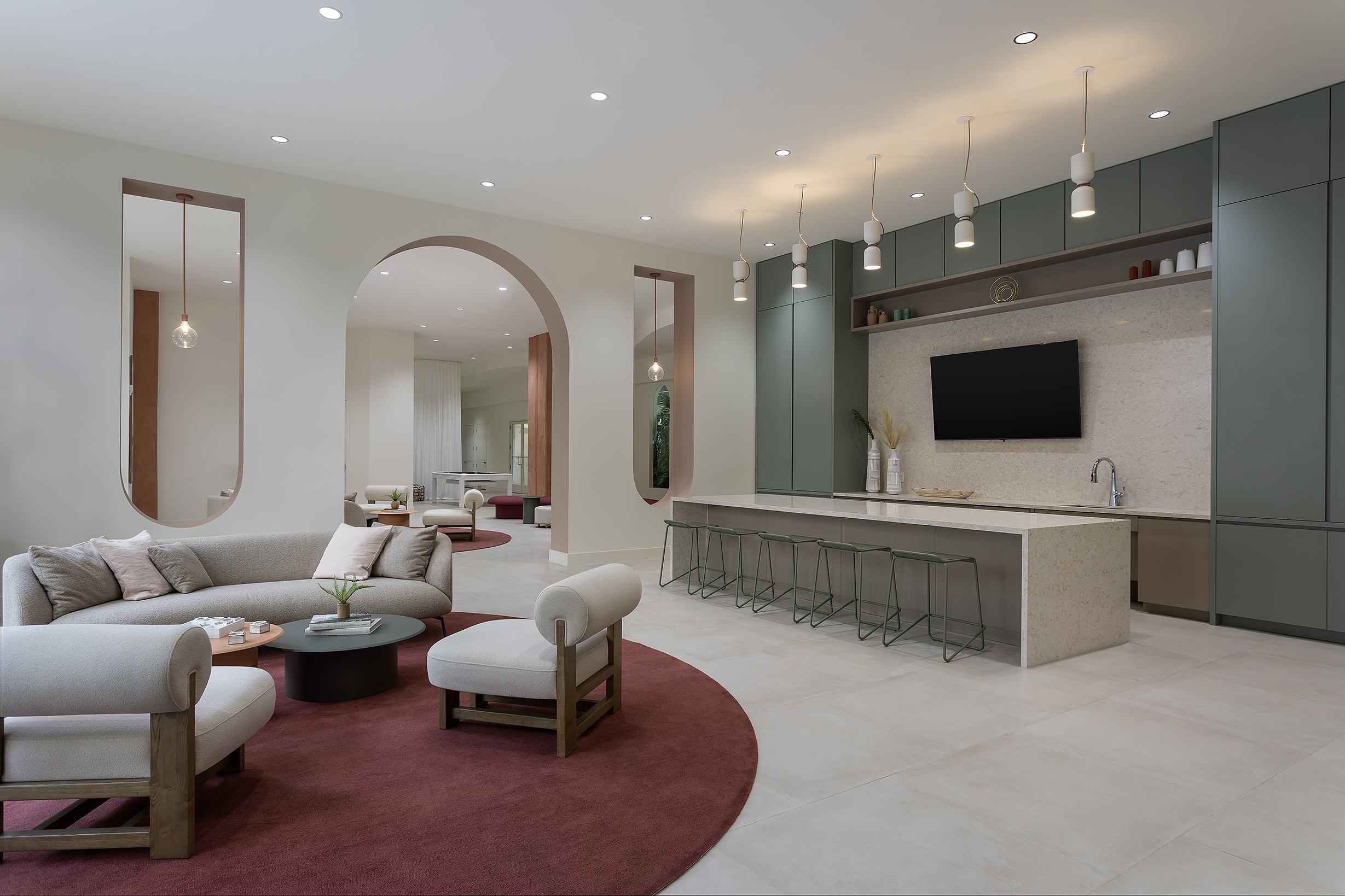 Amenity space with bar seating and pendant lights