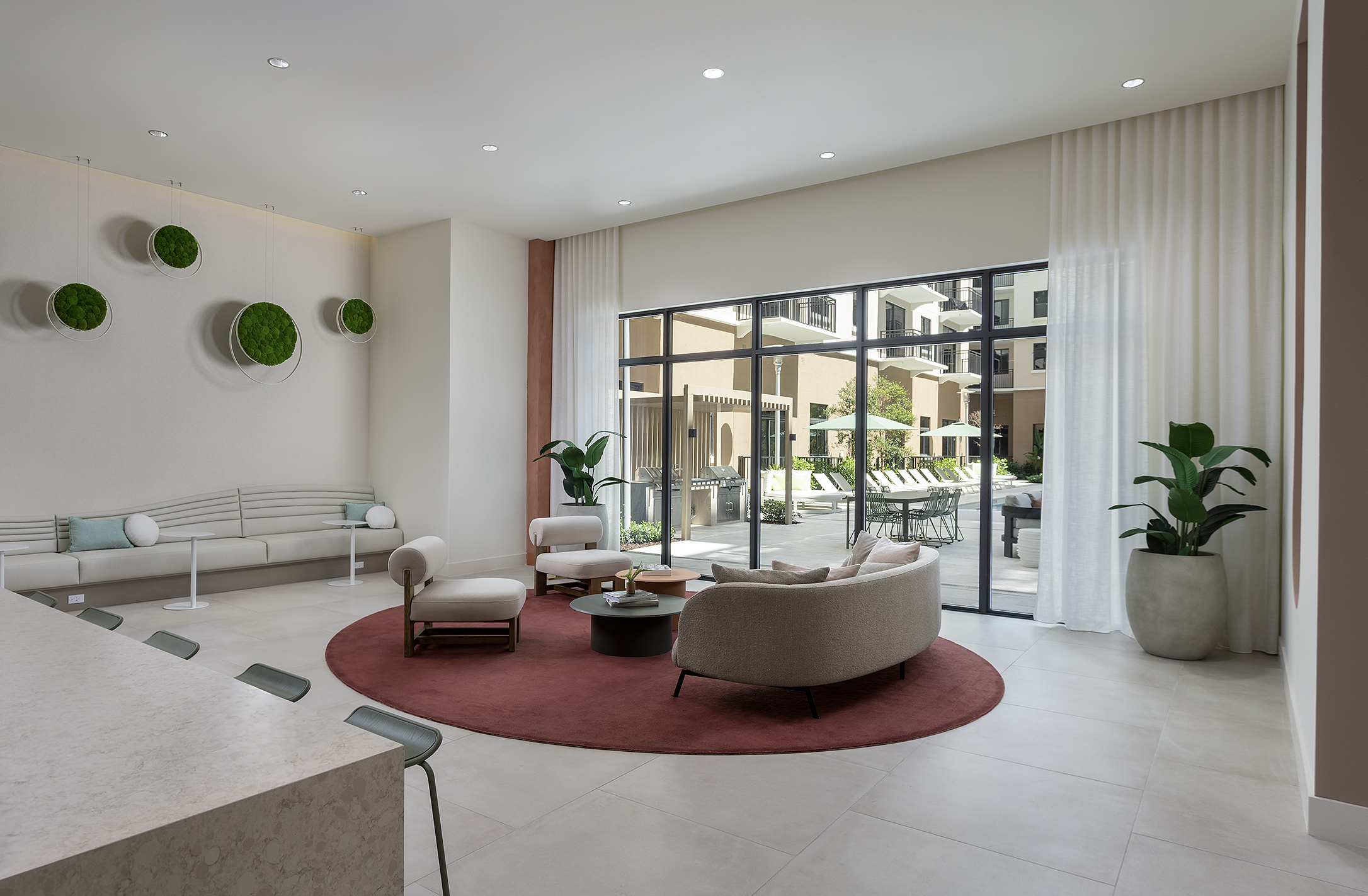 Lounge chairs by floor-to-ceiling windows