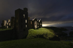 Slains Castle Scotland Backlight with drone lighting.