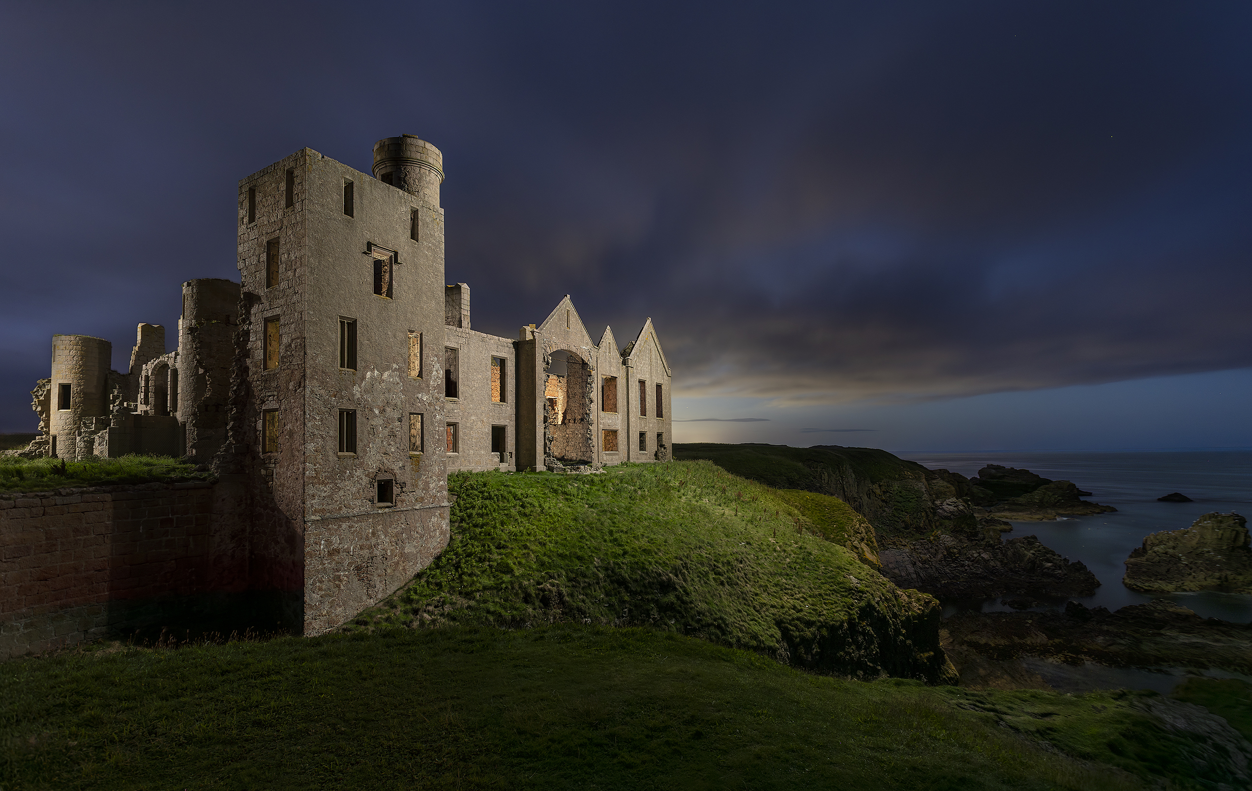 Slains Castle at night with dramatic lighting