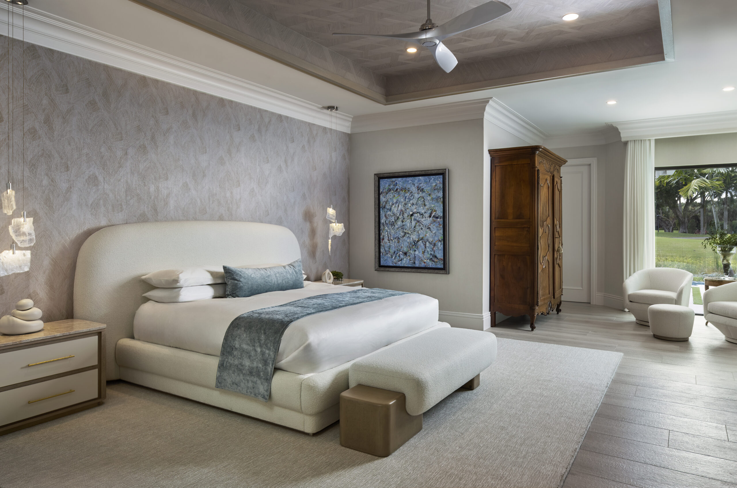 Luxury bedroom interior photography with soft neutral palette, upholstered bed, textured wall finish, ceiling detail, and seating area in a private residence