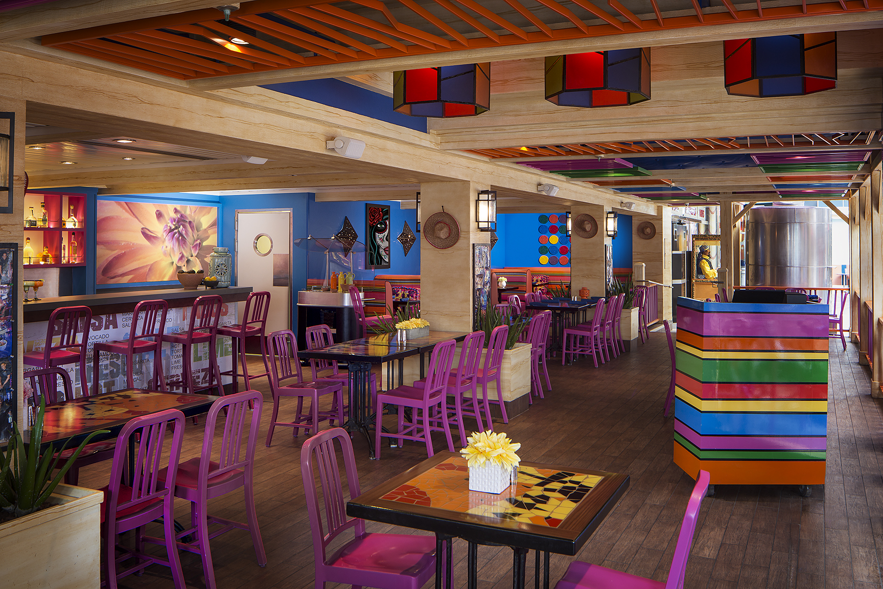 Wide interior photography of Sabor on Allure of the Seas showing colorful restaurant design, seating layout, and cruise ship dining environment